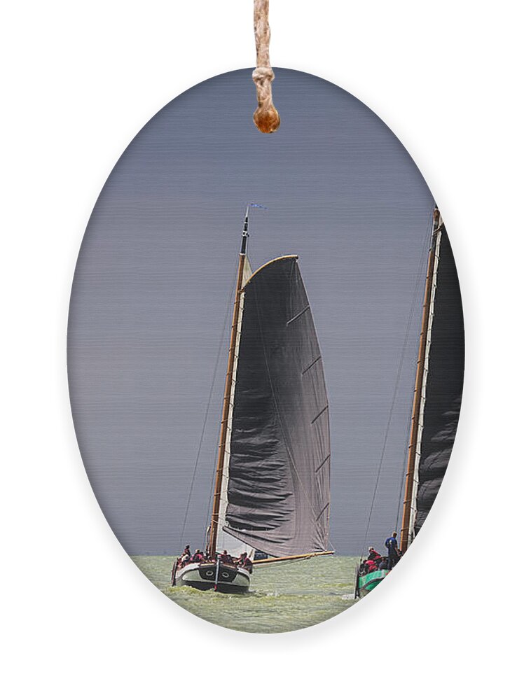 Regatta Ornament featuring the photograph Skutsje wedstrijd voor de wind by Jan Brons