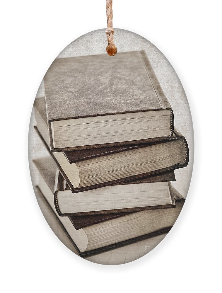 Books Ornament featuring the photograph Stack of books by Elena Elisseeva