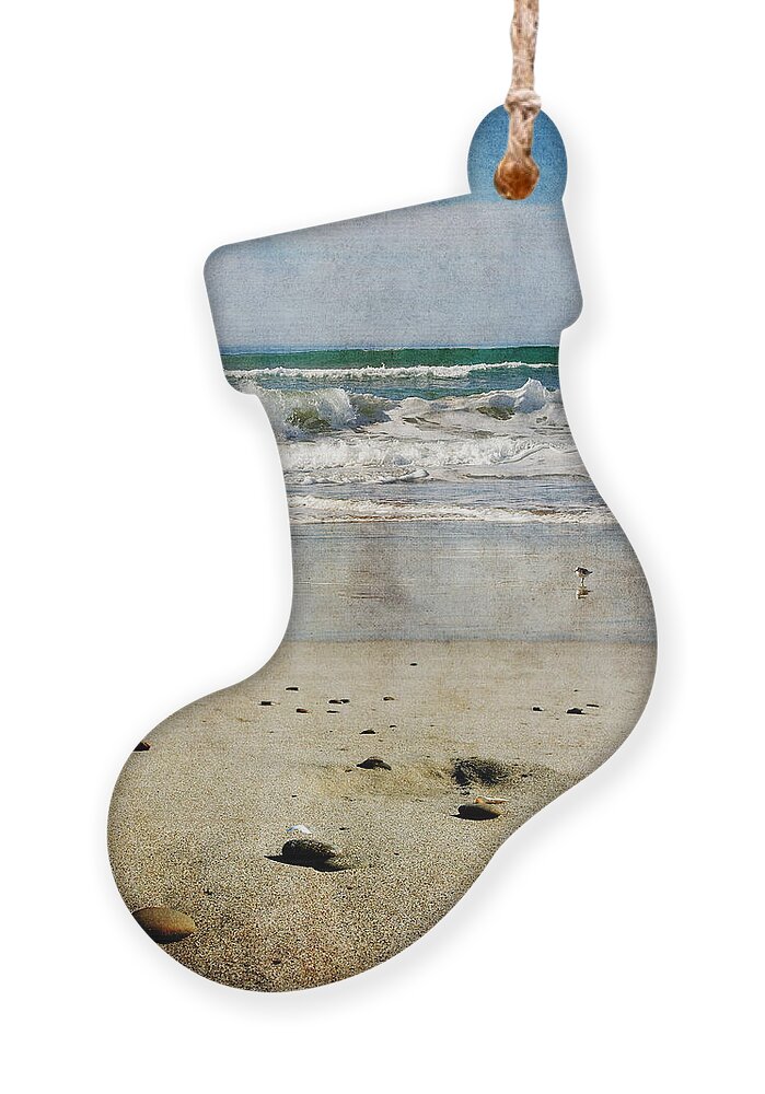 Zmudowski Ornament featuring the photograph Stones Along the Shore by Laura Iverson