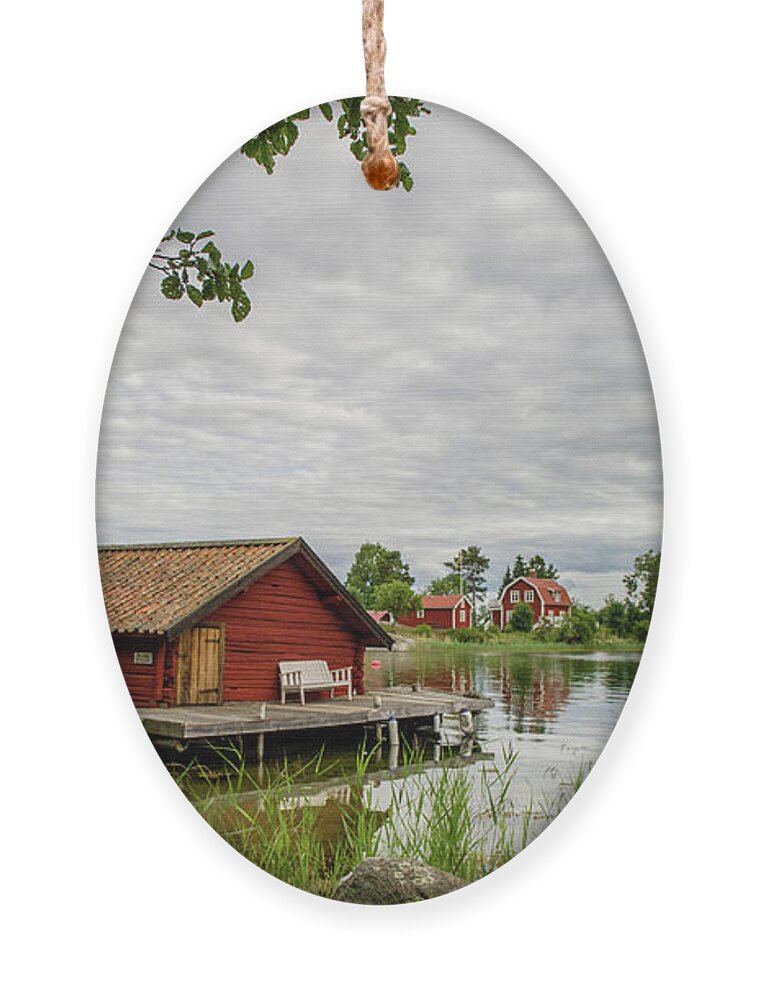 The Old Boat-house Ornament featuring the photograph The old boat-house by Torbjorn Swenelius