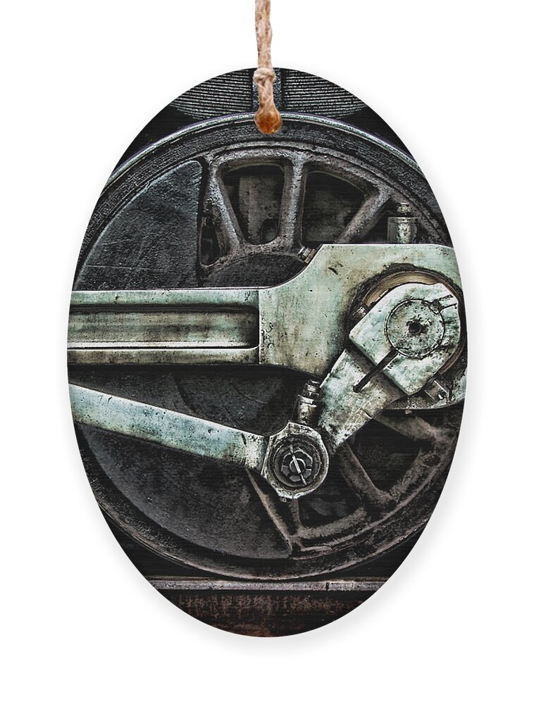 Steel Ornament featuring the photograph Grunge Old Steam Locomotive Wheel by Olivier Le Queinec