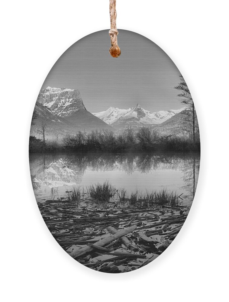 St Mary Ornament featuring the photograph St. Mary Driftwood Pond Reflections Black And White by Adam Jewell