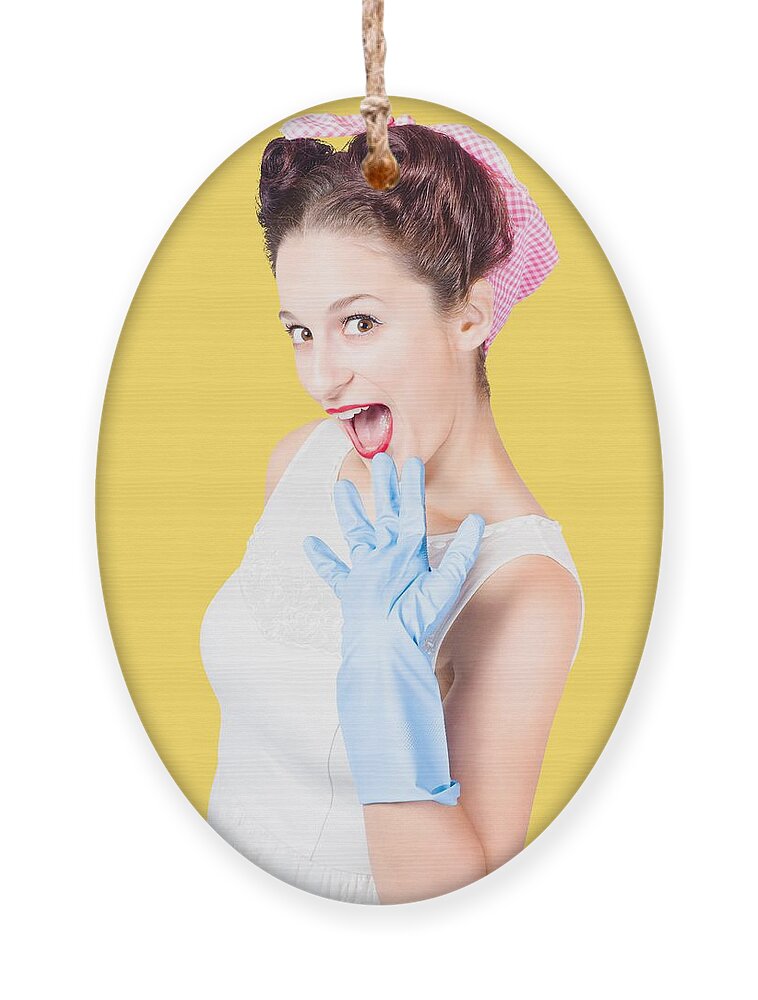 Pinup Ornament featuring the photograph Stunned cleaning house wife wearing rubber glove by Jorgo Photography
