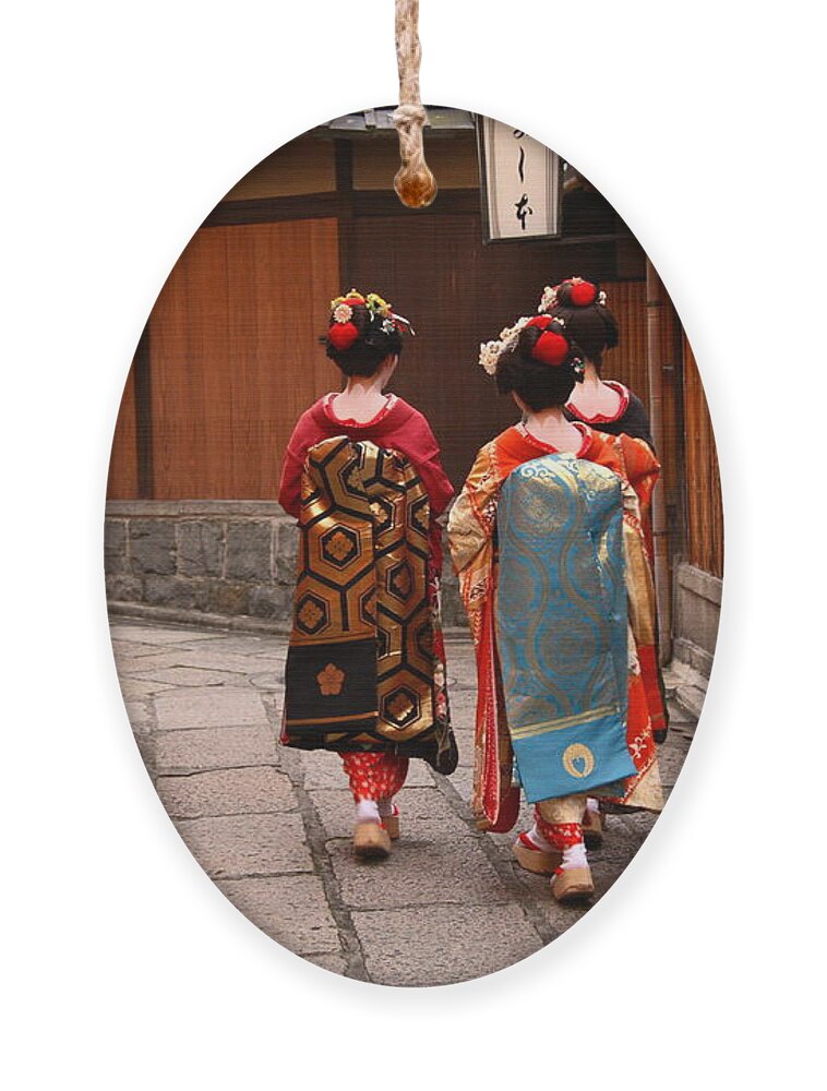 Delicate Ornament featuring the photograph Three Geishas Walking On A Street by Sergii Rudiuk