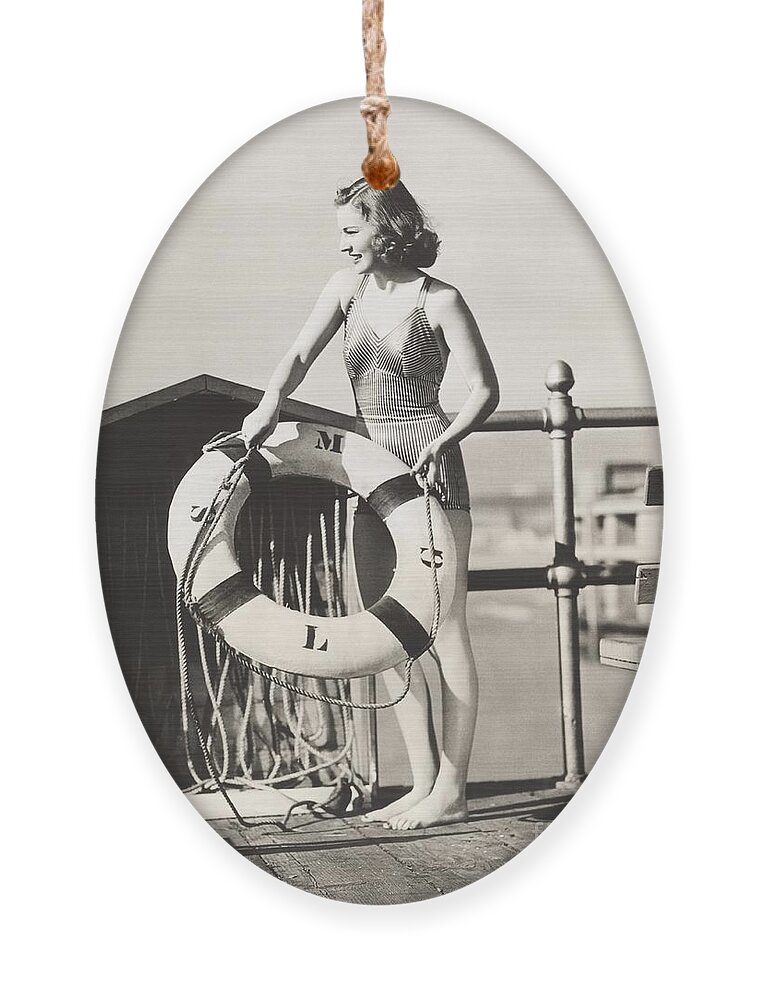 1910s Ornament featuring the photograph Woman On Pier Holding A Life Preserver by Everett Collection