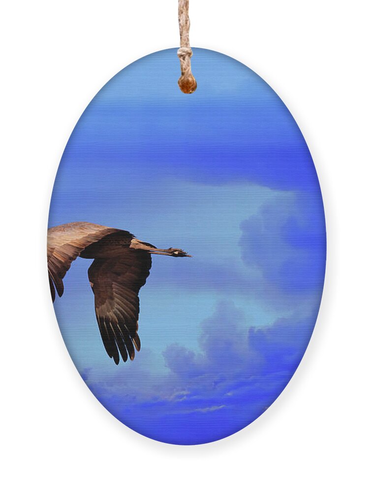 Wildlife Ornament featuring the photograph Against The Storm by Robert Harris