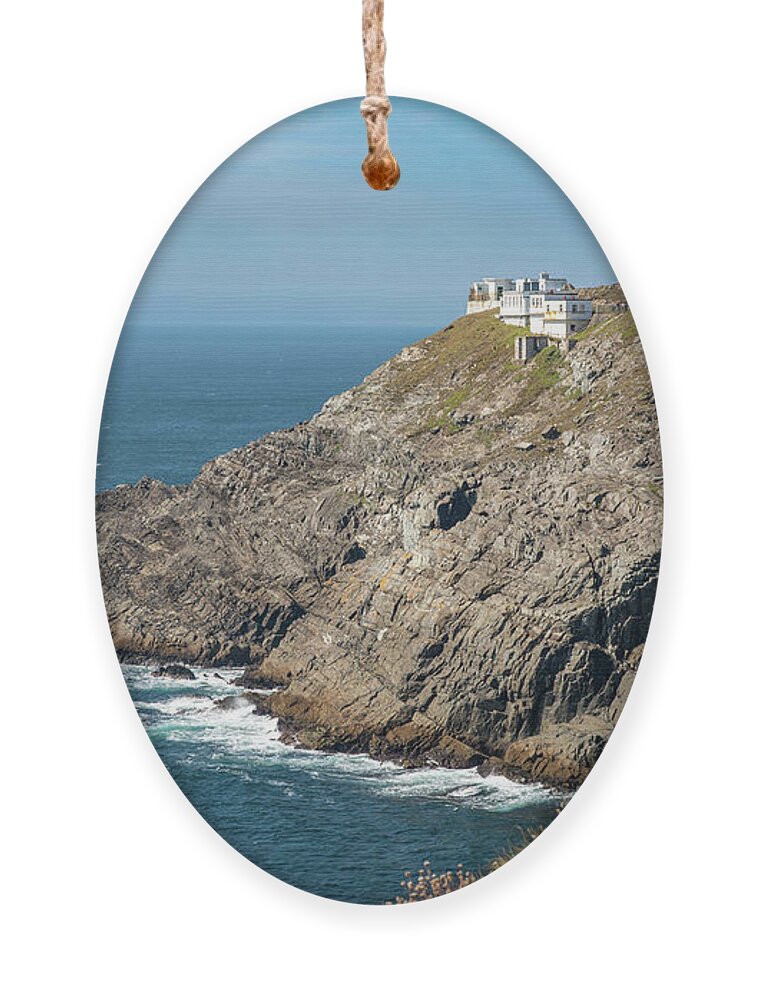 Mizen Head Ornament featuring the photograph Mizen Head Signal Station lighthouse with dramatic rocky coastline in the Atlantic ocean . County Cork, Ireland. #1 by Michalakis Ppalis