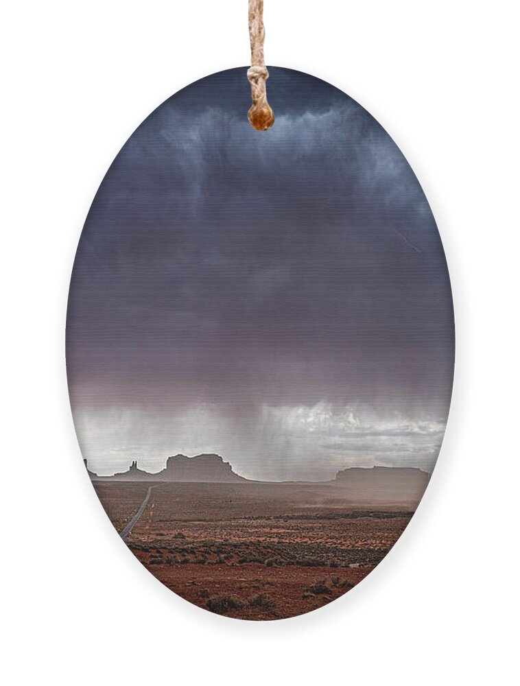 © 2022 Lou Novick All Rights Reversed Ornament featuring the photograph Monument Valley Storm #1 by Lou Novick
