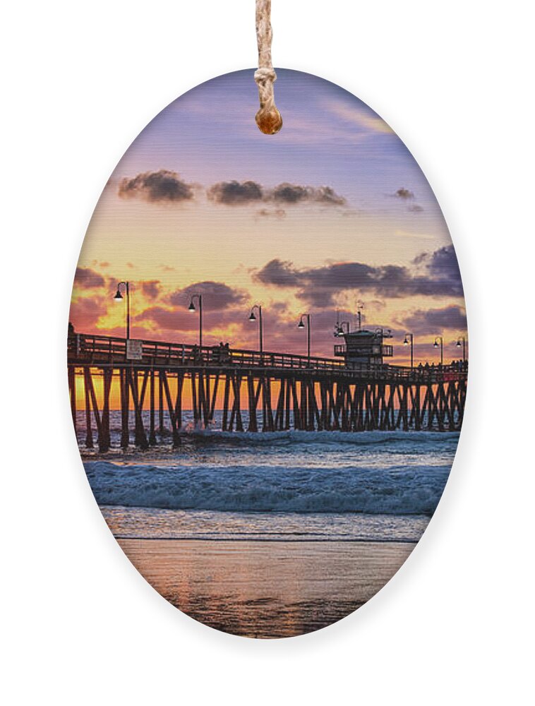 Beach Ornament featuring the photograph What Lights a Pier at Sunset by David Levin