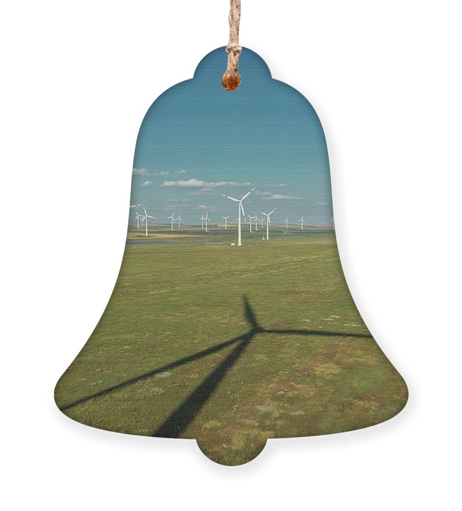 Wind Ornament featuring the photograph Aerial view of windmills and shadows in rotation by Mikhail Kokhanchikov