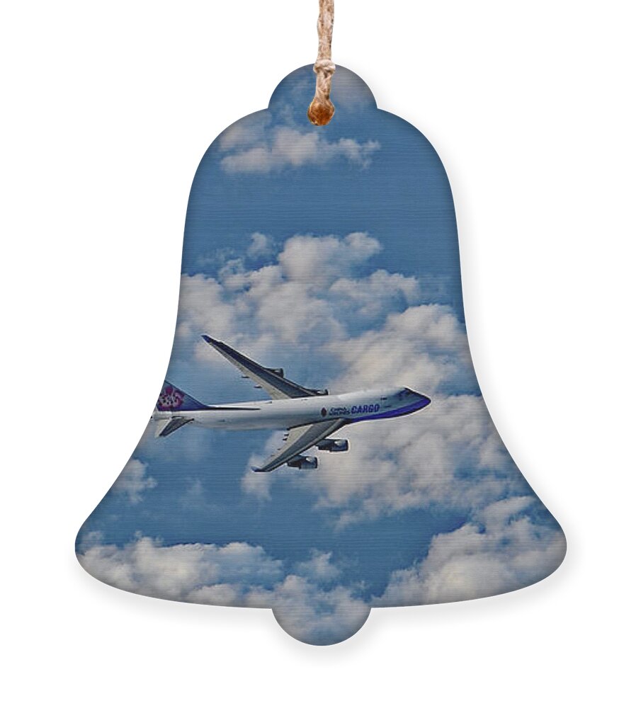 Airplane Ornament featuring the photograph Airplane Cruising Above the Cloud by Amazing Action Photo Video