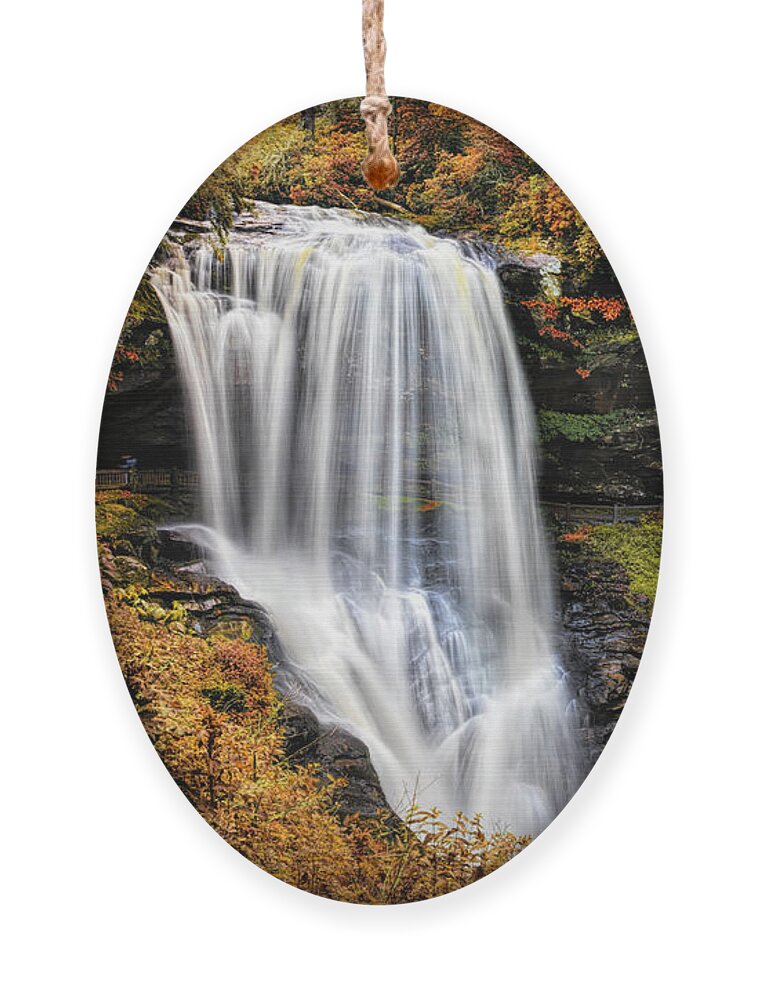 Carolina Ornament featuring the photograph Autumn Colors at Dry Falls by Debra and Dave Vanderlaan