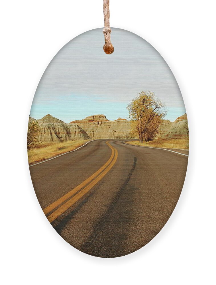 Badlands National Park Ornament featuring the photograph Badland Blacktop by Lens Art Photography By Larry Trager