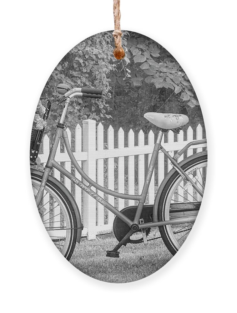 Carolina Ornament featuring the photograph Bicycle by the Garden Fence II Black and White by Debra and Dave Vanderlaan