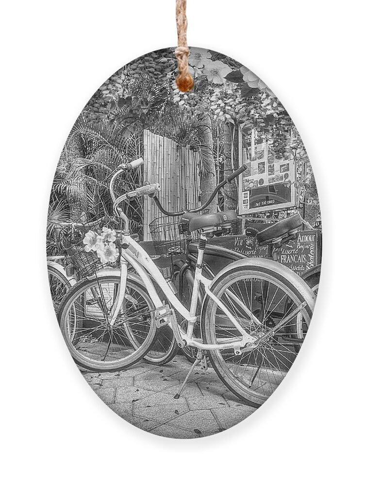 Florida Ornament featuring the photograph Bicycles at the Bakery Courtyard in Black and White by Debra and Dave Vanderlaan