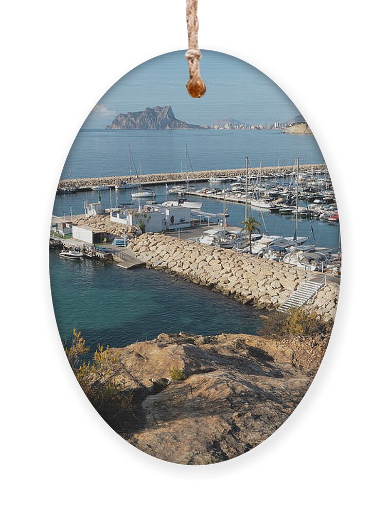 Mediterranean Coast Ornament featuring the photograph Blue Mediterranean Sea and marina in Moraira 1 by Adriana Mueller