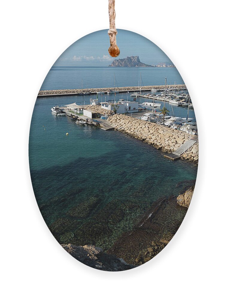 Mediterranean Coast Ornament featuring the photograph Blue Mediterranean Sea and marina in Moraira 2 by Adriana Mueller