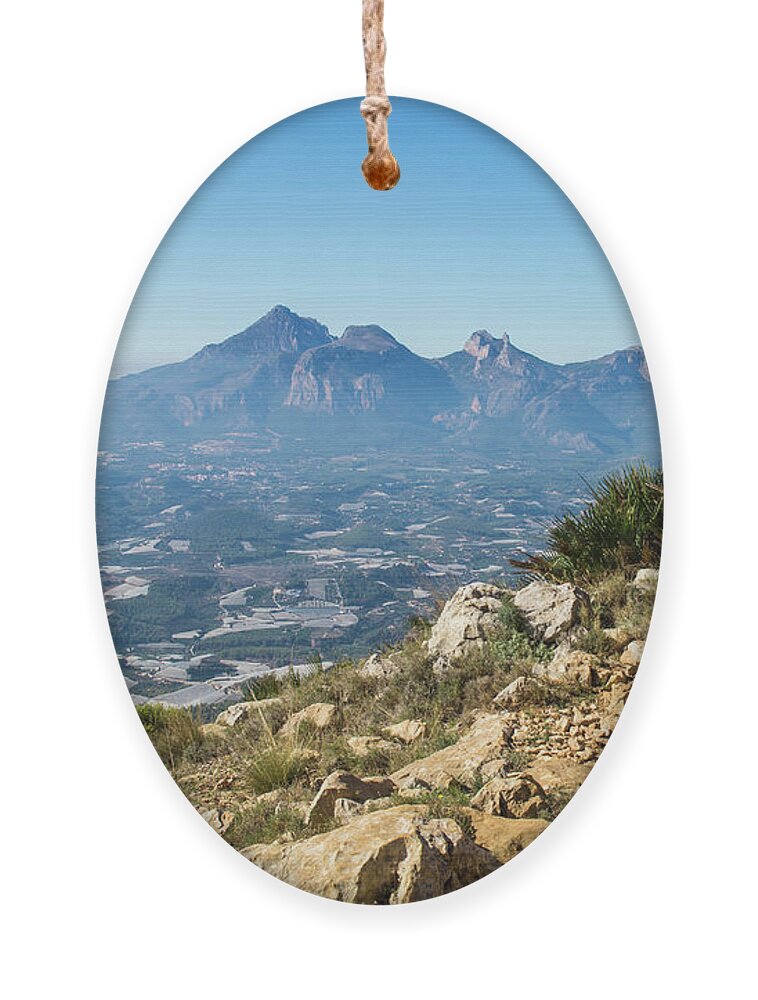 Mountains Ornament featuring the photograph Blue mountain landscape with Puig Campana by Adriana Mueller