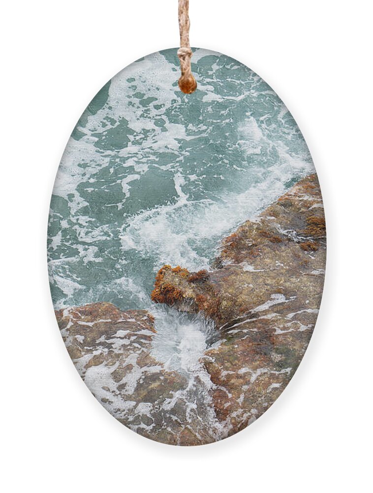 Sea Water Ornament featuring the photograph Blue sea water flows over the rocks 1 by Adriana Mueller