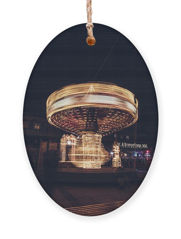 Illuminations Ornament featuring the photograph Christmas carousel on the streets of Warsaw. Fire Wheel by Vaclav Sonnek
