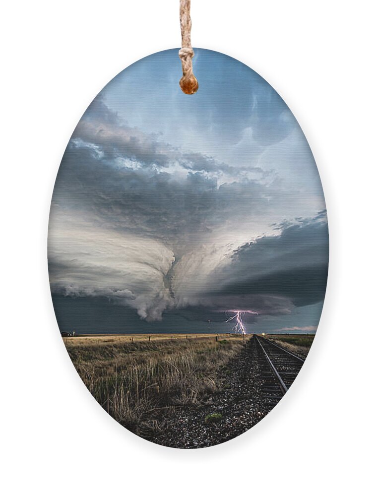Weather Ornament featuring the photograph Collision Course by Marcus Hustedde