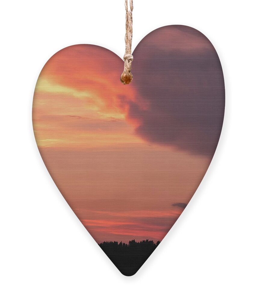 Orange Sunset Ornament featuring the photograph Colorful Sunset over Tree Silhouettes by Alexios Ntounas