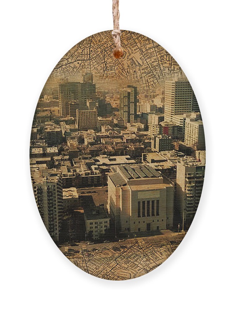 Oakland Ornament featuring the digital art Downtown Oakland skyline blended with an 1938 map of the city, and printed on old paper texture by Nicko Prints
