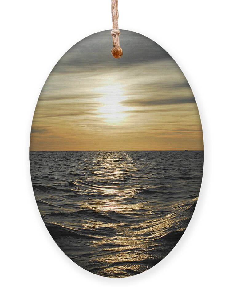 Tranquil Ornament featuring the photograph Dramatic sunset in the sea by Severija Kirilovaite