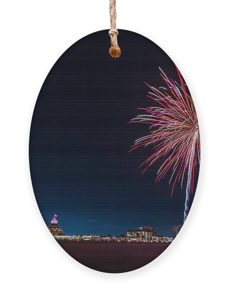 Resort Ornament featuring the photograph Evening fireworks display at the Hotel del Coronado on the beach along the Pacific Ocean by Sam Antonio