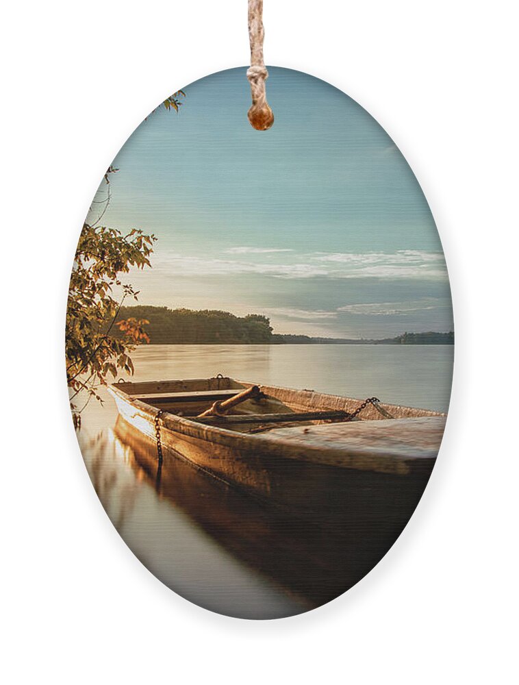 Rowboat Ornament featuring the photograph Fairy-tale boat moored on the shore by Vaclav Sonnek