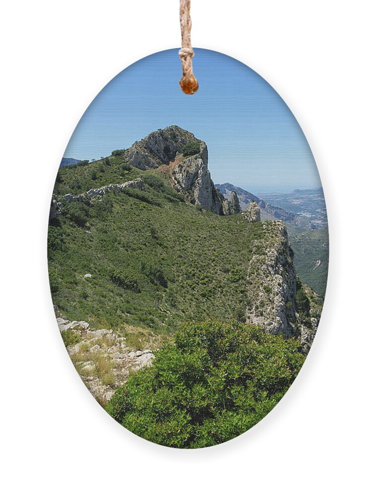 Mountain Ornament featuring the photograph Ferrer mountain ridge and view of Puig Campana by Adriana Mueller