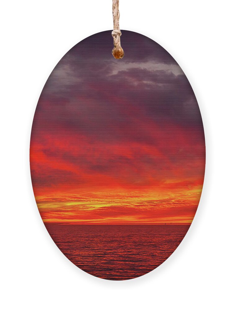 Sunset Ornament featuring the photograph Fiery Sunset in Oceanside - January 10, 2022 by Rich Cruse