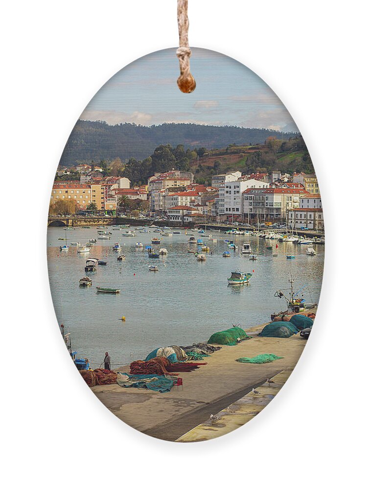 Cityscape Ornament featuring the photograph Fishermen Repairing Nets on the Beautiful Fishing Town of Pontedeume La Coruna Galicia by Pablo Avanzini