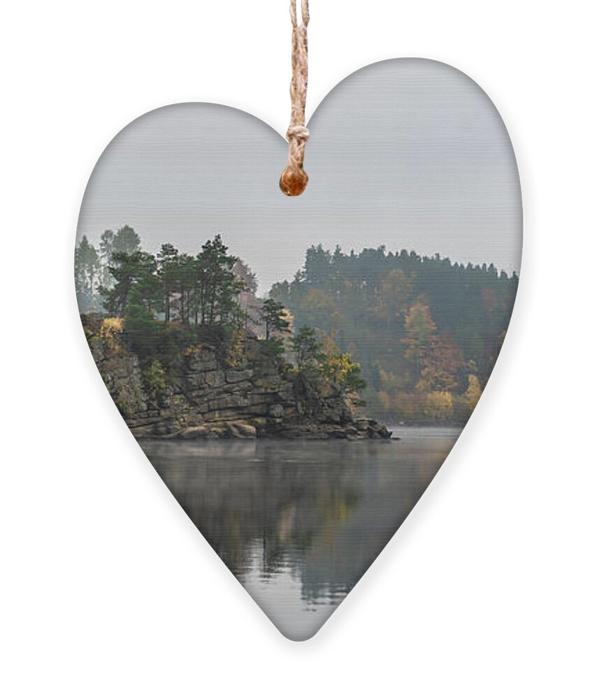 Austria Ornament featuring the photograph Foggy Landscape With Fishermans Boat On Calm Lake And Autumnal Forest At Lake Ottenstein In Austria by Andreas Berthold