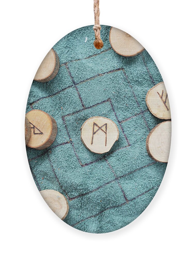 Runes Ornament featuring the photograph Handmade runes for fortunetelling by Anastasy Yarmolovich