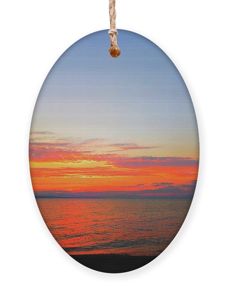 Harmony Of Sunset Over The Seascape Ornament featuring the photograph Harmony of Sunset Over The Seascape by Leonida Arte