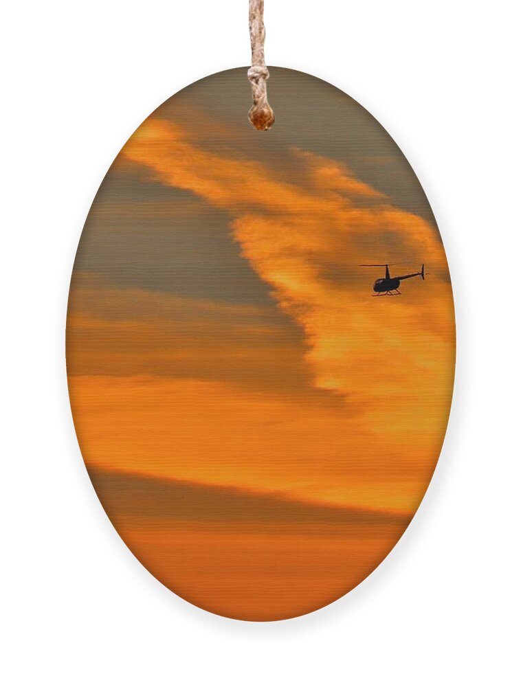 Helicopter Ornament featuring the photograph Helicopter Approaching at Sunset by Linda Stern