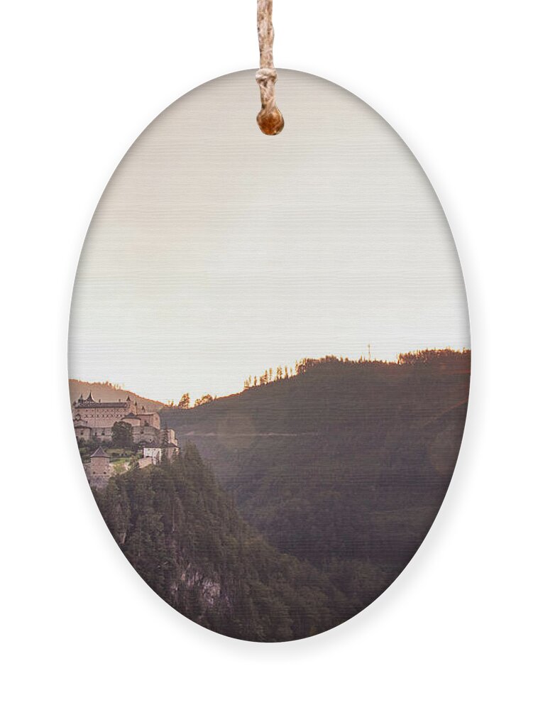 Reconstruction Ornament featuring the photograph Hohenwerfen Castle at sunset by Vaclav Sonnek