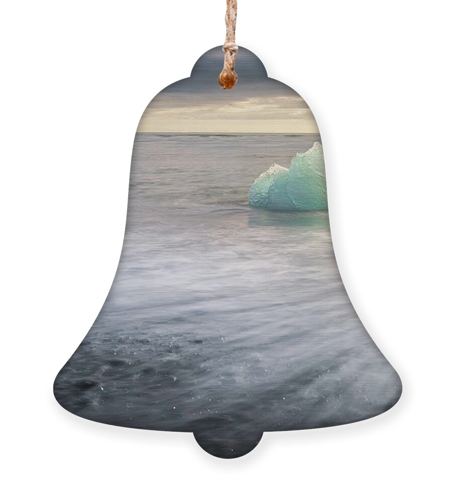 Iceberg Ornament featuring the photograph Iceberg at Diamond Beach in Iceland at sunrise by Alexios Ntounas