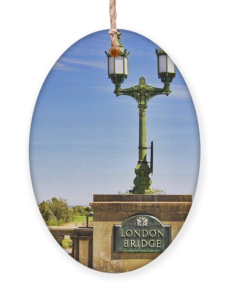 London Bridge Ornament featuring the photograph London Bridge original sign, Arizona by Tatiana Travelways