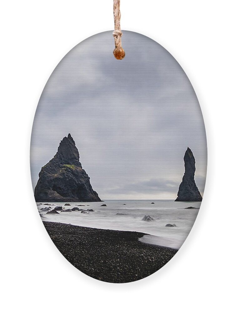 Reynisfjara Ornament featuring the photograph Reynisfjara black sand beach and Reynisdrangar in Iceland by Alexios Ntounas