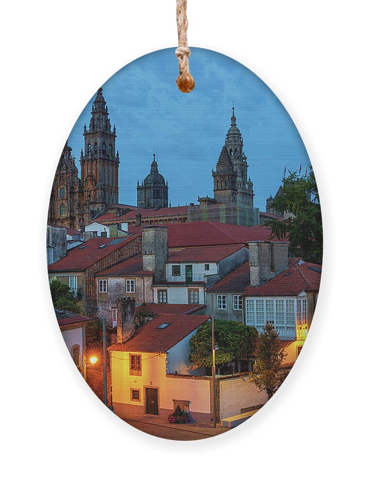 Way Ornament featuring the photograph Santiago de Compostela Cathedral Spectacular View by Night Dusk with Street Lights and Tiled Roofs La Corua Galicia by Pablo Avanzini