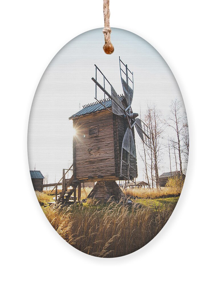Medieval Ornament featuring the photograph Small wooden mill with beautiful sun star by Vaclav Sonnek