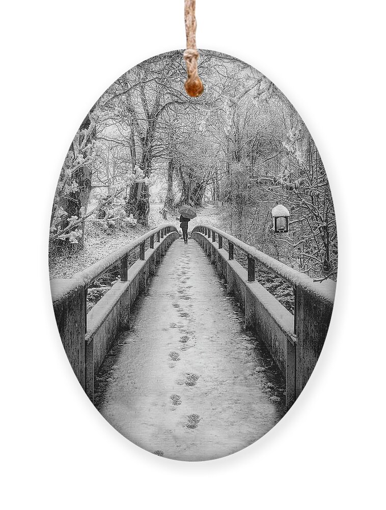 Bridge Ornament featuring the photograph Snowy Walk in Black and White by Debra and Dave Vanderlaan