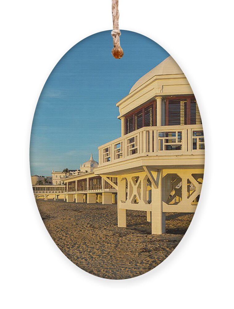 Seascape Ornament featuring the photograph Spa at La Caleta under a Blue Sky Beach in Cadiz Andalusia by Pablo Avanzini