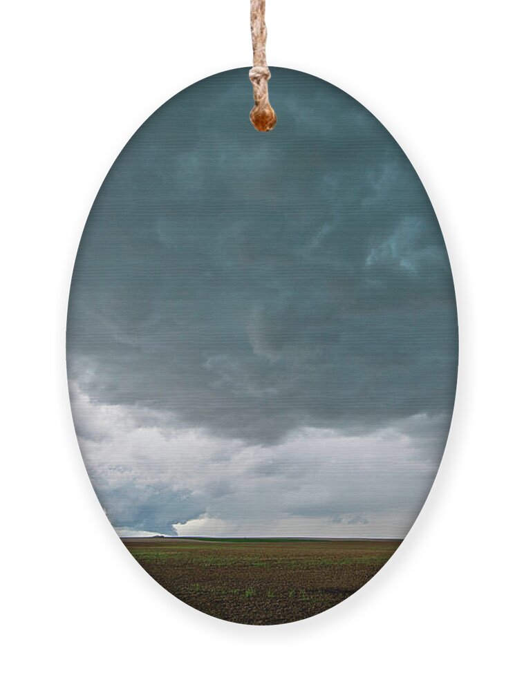 Storm Ornament featuring the photograph Storm over the Plains by Wesley Aston