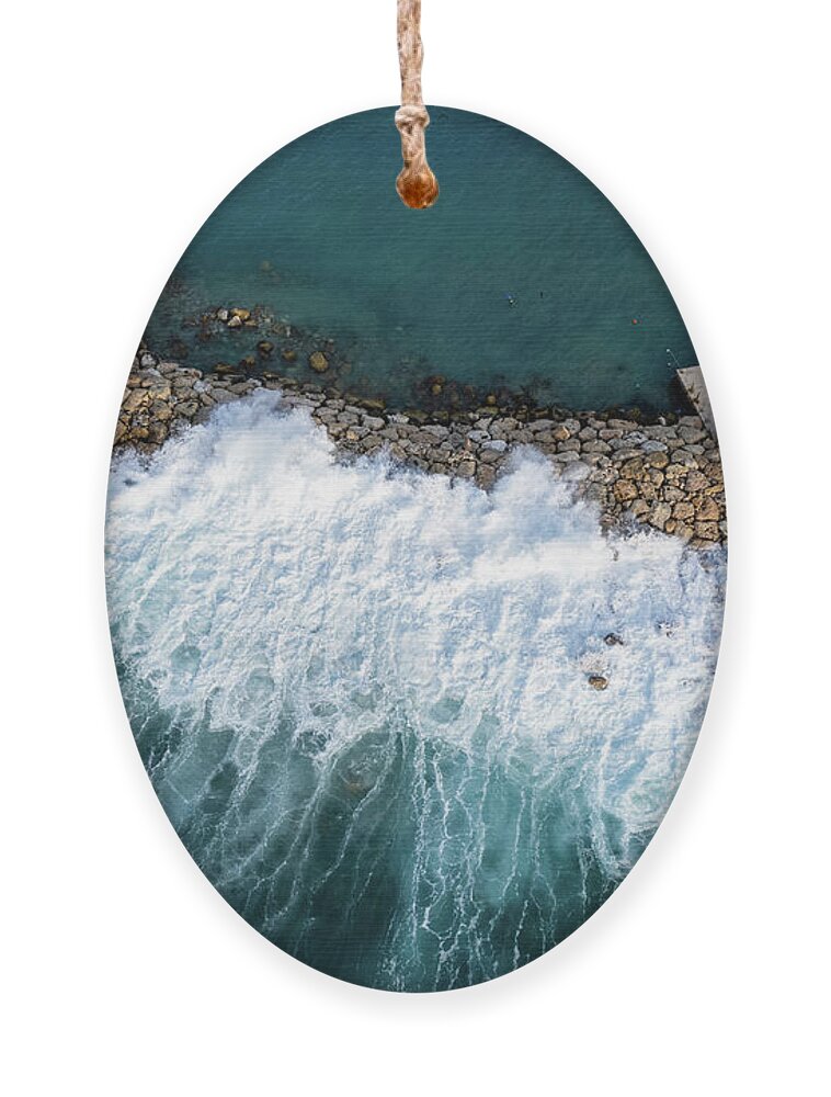 Brakewater Ornament featuring the photograph Stormy windy waves on the shore. Drone photography. by Michalakis Ppalis
