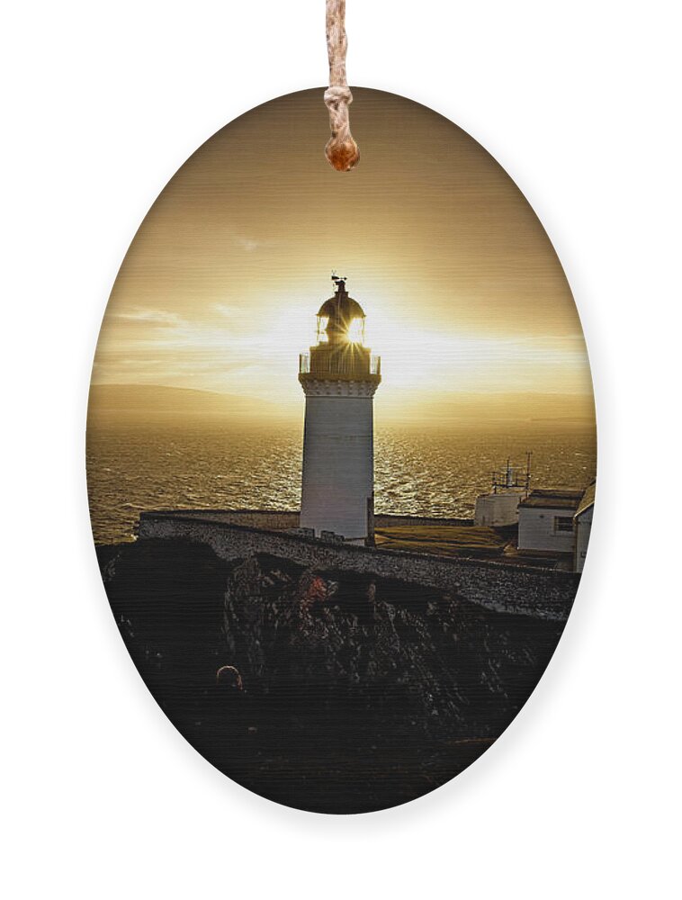 Biblical Light Ornament featuring the photograph Sun setting over Bressay Lighthouse by Tony Mills