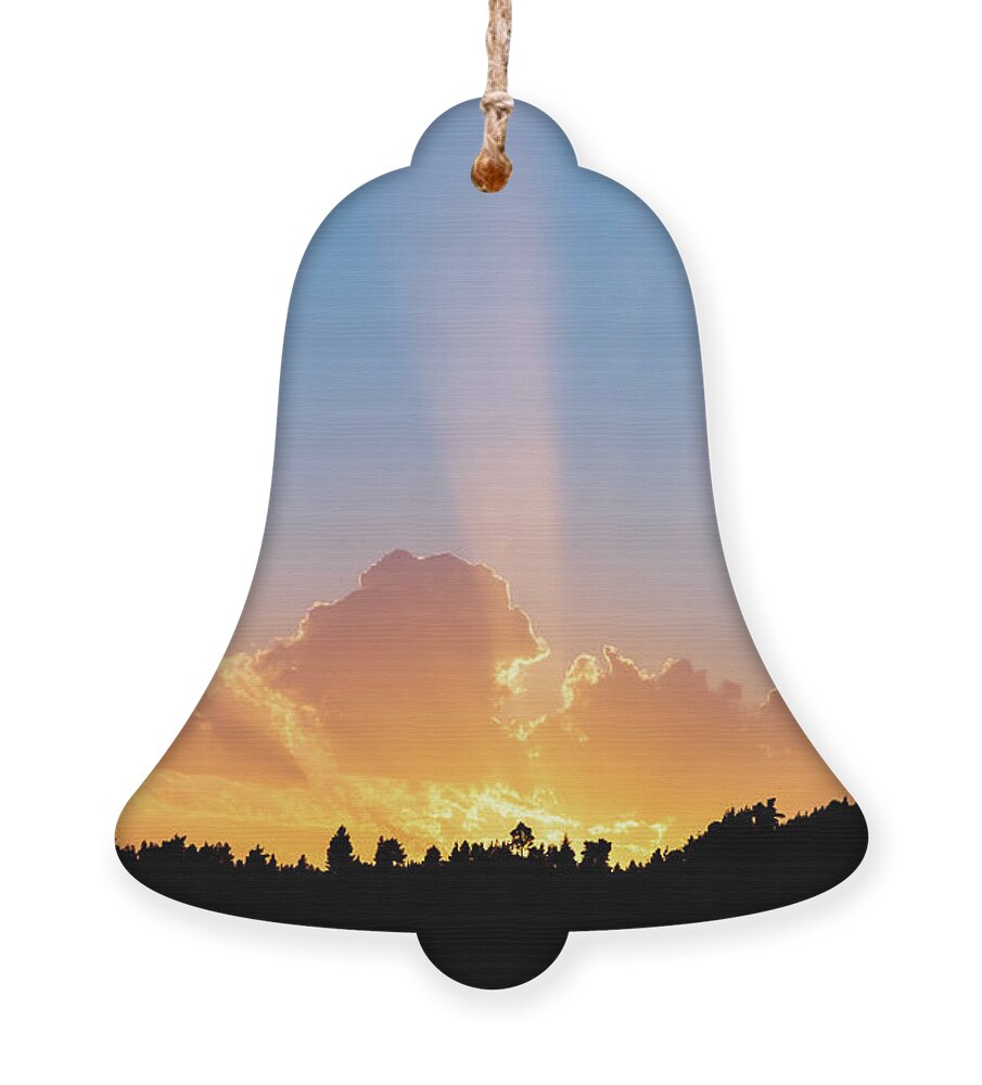 Sunbeam Ornament featuring the photograph Sunbeams Shining Over Tree Silhouettes by Alexios Ntounas