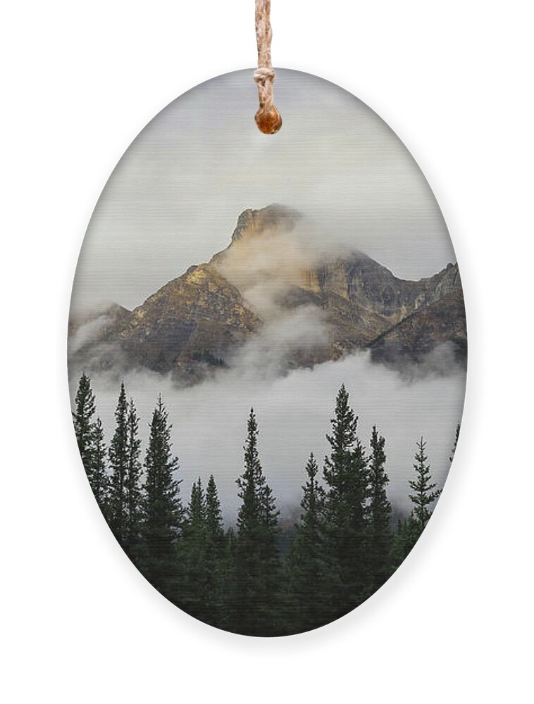 Sunlit Mountain Peak Canadian Rockies Ornament featuring the photograph Sunlit Mountain Peak Canadian Rockies by Dan Sproul